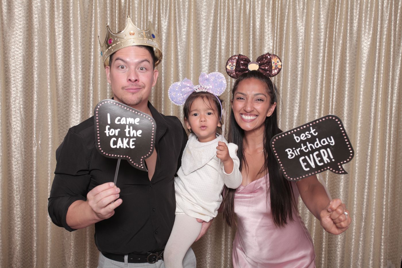 Family candid photo at a princess-themed 1st birthday